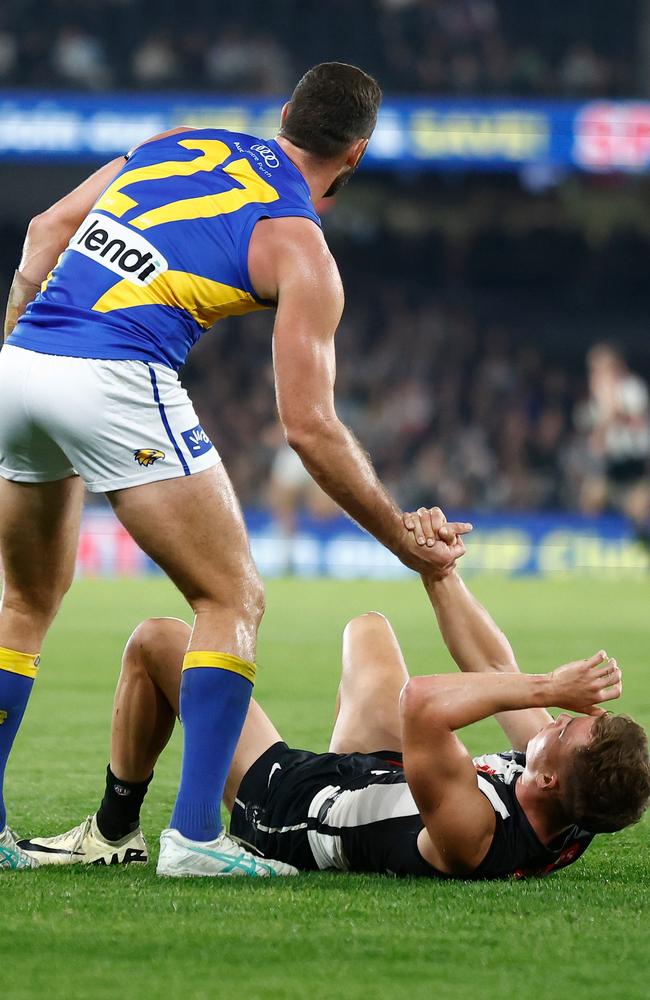 Jack Darling checks on Jack Bytel after the Pie was hurt late in their clash at Marvel Stadium. Picture: Michael Willson/AFL Photos via Getty Images.