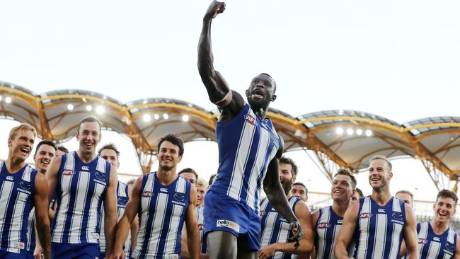 Majak Daw celebrates with his North Melbourne teammates at a game in 2020. The 32-year-old retired from professional footy in 2022. Pic: Michael Klein