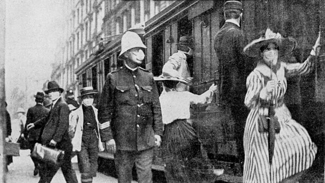 1919: Train travellers wearing masks try to avoid the Spanish flu epidemic.