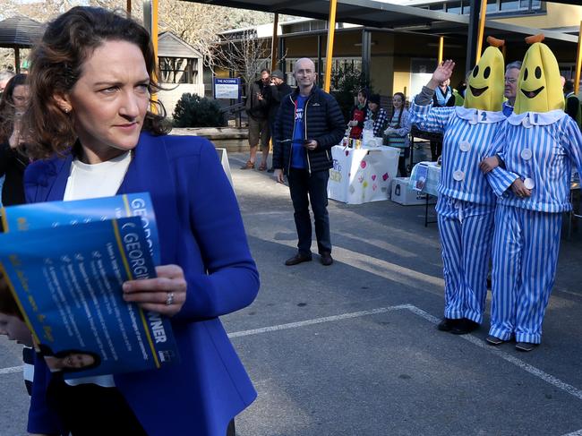 Volunteers dressed as the Bananas in Pyjamas from activist group GetUp arr seen following around Liberal candidate Georgina Downer at the Stirling East Primary School polling booth in Stirling, Adelaide, Saturday, July 28, 2018. Dubbed "Super Saturday", five federal simultaneous byelections will be held today, unprecedented in Australian election history after sitting members of parliament were forced to resign due to dual citizenship in breach of the Constitution. (AAP Image/Kelly Barnes) NO ARCHIVING