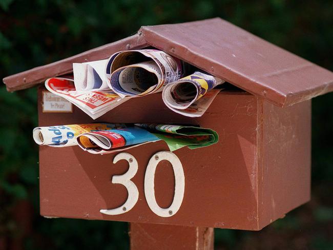 Letterbox full of junk mail 05 Nov 1998. catalogues advertising brochures