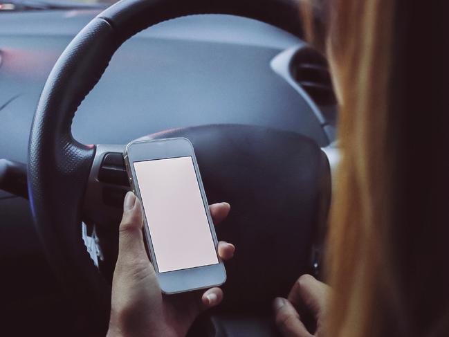 Women using phone while driving . Picture: iStock