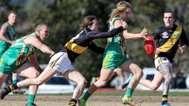 EFL: Jesse Cherry of Mitcham tackles Mooroolbark’s Austin Smith. Picture: George Salpigtidis