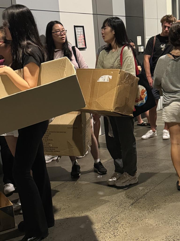 Women had boxes ready to fill with clothes. Picture: News.com.au