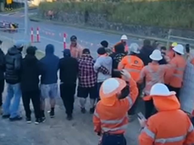 Footage taken Wednesday morning reveals CFMEU and non-aligned workers scuffling after the union blocked access to the worksite near Cross River Rail building site at Fairfield.