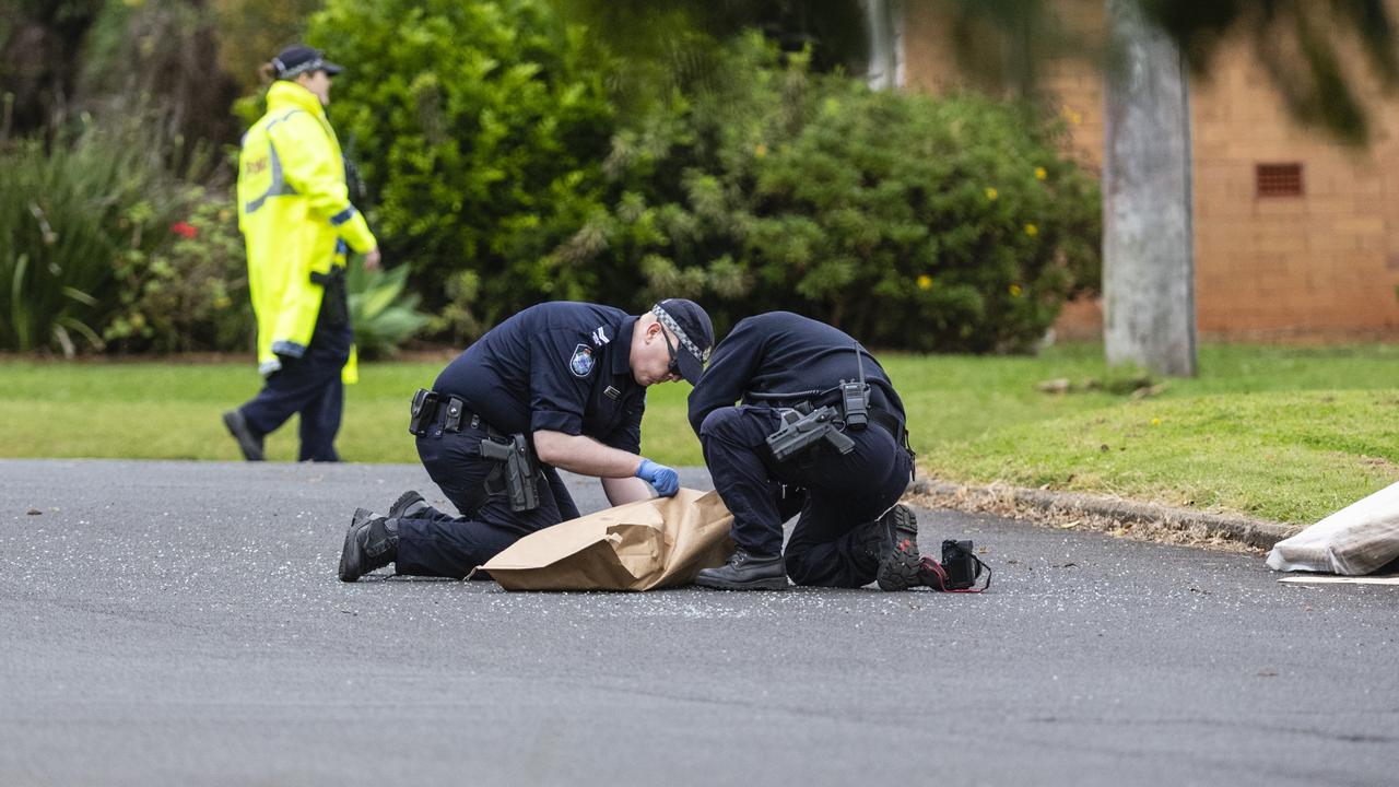 Investigators at a police incident in Harristown, Friday, May 6, 2022. Picture: Kevin Farmer