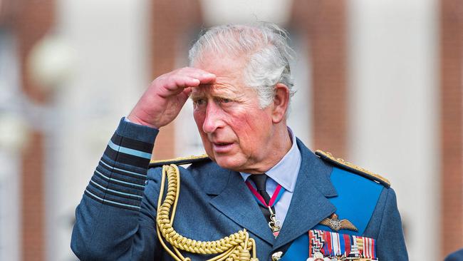 (FILES) In this file photo taken on July 16, 2020 Marshal of The Royal Air Force, Britain's Prince Charles, Prince of Wales gestures as he talks to cadets after the Graduation Ceremony of the Queenâs Squadron and Sovereignâs Review at RAF College Cranwell in eastern England. - Charles has spent virtually his entire life waiting to succeed his mother, Queen Elizabeth II, even as he took on more of her duties and responsibilities as she aged. But the late monarch's eldest son, 73, made the most of his record-breaking time as the longest-serving heir to the throne by forging his own path. (Photo by JULIAN SIMMONDS / POOL / AFP)