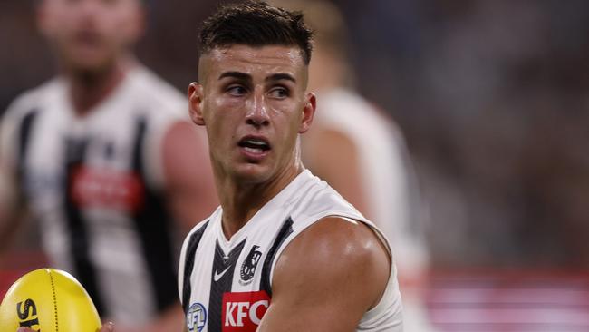 MELBOURNE, AUSTRALIA - MARCH 21: Nick Daicos of the Magpies runs with the ball during the round two AFL match between St Kilda Saints and Collingwood Magpies at Melbourne Cricket Ground, on March 21, 2024, in Melbourne, Australia. (Photo by Darrian Traynor/Getty Images)