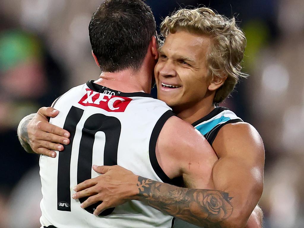 MELBOURNE, AUSTRALIA – AUGUST 10: Quinton Narkle and Travis Boak of the Power celebrate winning the round 22 AFL match between Melbourne Demons and Port Adelaide Power at Melbourne Cricket Ground, on August 10, 2024, in Melbourne, Australia. (Photo by Josh Chadwick/Getty Images)