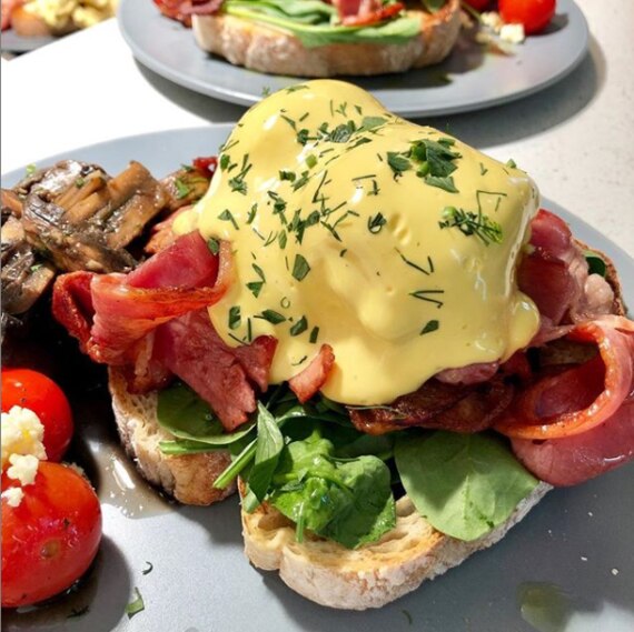 The Rabbit Hole Cafe plates up a popular Eggs Benny at its Wynnum and Seven Hills locations. Picture: Instagram/therabbitholecafe