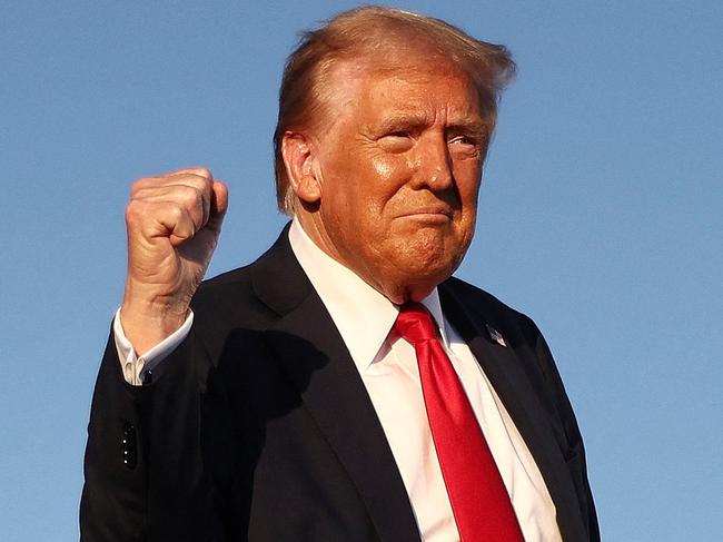 COACHELLA, CALIFORNIA - OCTOBER 12: Republican presidential nominee, former U.S. President Donald Trump gestures while walking onstage for a campaign rally on October 12, 2024 in Coachella, California. With 24 days to go until election day, former President Donald Trump is detouring from swing states to hold the rally in Democratic presidential nominee, Vice President Kamala Harris' home state.   Mario Tama/Getty Images/AFP (Photo by MARIO TAMA / GETTY IMAGES NORTH AMERICA / Getty Images via AFP)