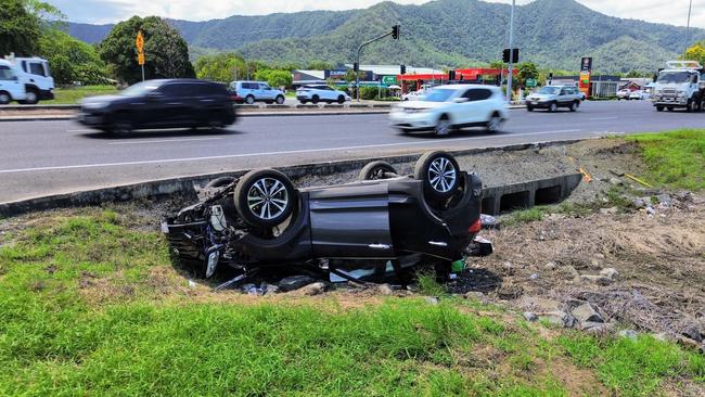 Division 2 councillor Matt Tickner would like to see the state and federal governments fast track the master plan for the Bruce Highway intersection at Robert and Swallow Road in Bentley Park, the location of two fatal accidents in the past month. An upturned car sits crashed on the Swallow Road side of the intersection. Picture: Brendan Radke