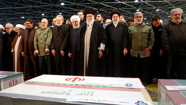 Ayatollah Ali Khamenei, centre, flanked by Hassan Rouhani, left, and Ebrahim Raisi and Esmail Qaani, right, at Monday’s Tehran funeral. Picture: AFP