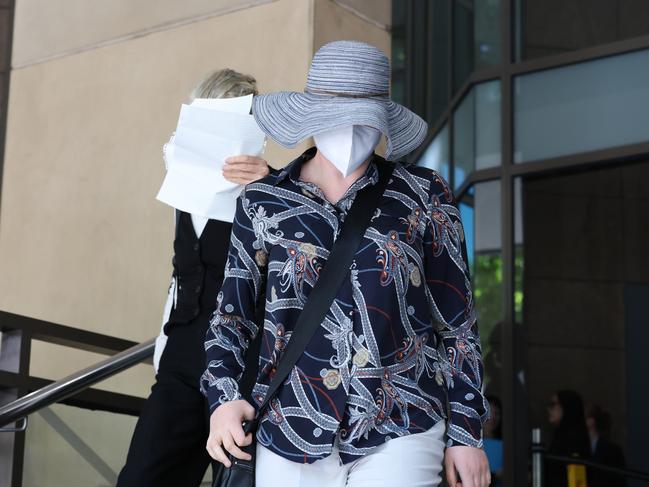 MELBOURNE, AUSTRALIA- NewsWire Photos FEBRUARY 18, 2025: Contest mention for Matilda Mcdermott, 18, accused of attacking Jewish Labor MP Josh Burns' St Kilda Office with red paint. She is pictured leaving the Melbourne Magistrate court covered up (mother on L). Picture:  NewsWire/ David Crosling