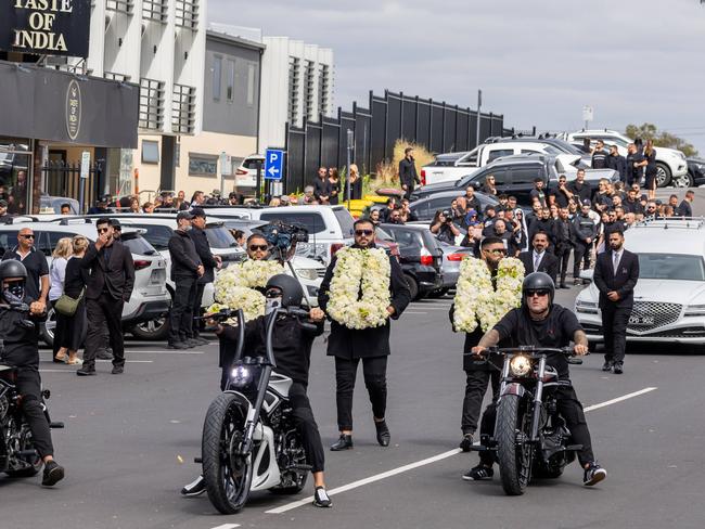 A motorbike procession leads a hearse carrying Abdulrahim’s body to the burial.