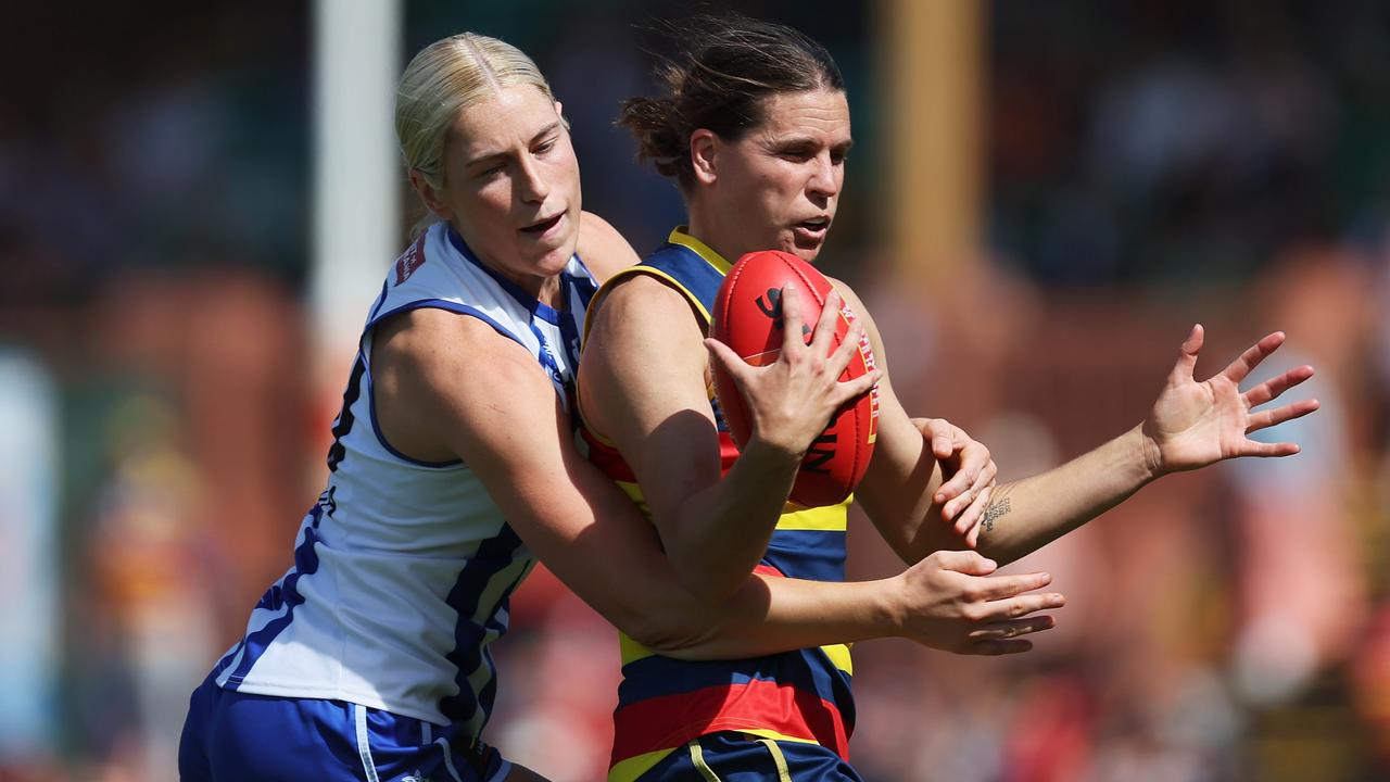 ADELAIDE, AUSTRALIA - OCTOBER 29: Jasmine Ferguson of the Kangaroos tackles Chelsea Randall of the Crows during the 2023 AFLW Round 09 match between The Adelaide Crows and The North Melbourne Tasmanian Kangaroos at Norwood Oval on October 29, 2023 in Adelaide, Australia. (Photo by James Elsby/AFL Photos via Getty Images)