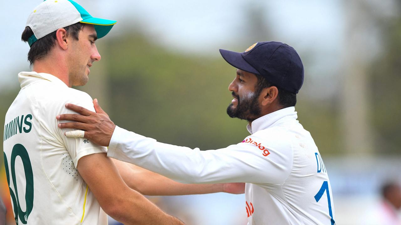 Sri Lanka's captain Dimuth Karunaratne shakes hands with his Aussie counterpart, Pat Cummins. Picture: AFP