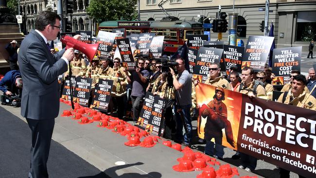 Then opposition leader Daniel Andrews addresses firefighters on the steps of the Victorian Parliament in Melbourne in 2014.