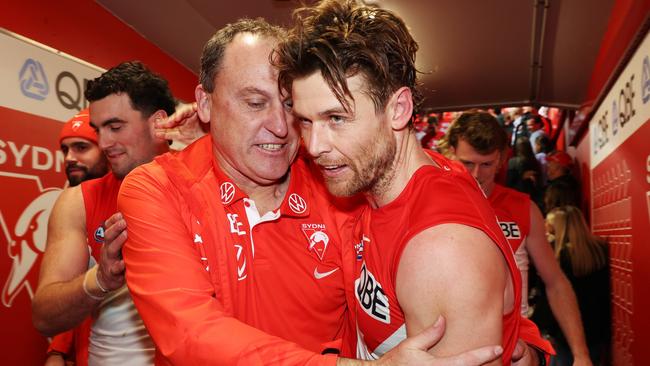 SYDNEY, AUSTRALIA - JULY 13:  Swans head coach John Longmire celebrates with Dane Rampe of the Swans after victory during the round 18 AFL match between Sydney Swans and Western Bulldogs at Sydney Cricket Ground, on July 13, 2023, in Sydney, Australia. (Photo by Mark Metcalfe/AFL Photos/via Getty Images)