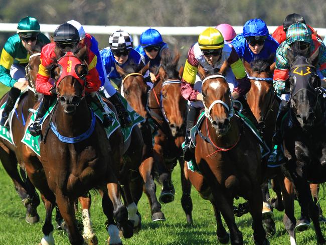 Loving home ridden by Tye Angland  (yellow cap, maroon with yellow armbands) wins race 1 during Scone  Races located in the Upper Hunter Region of NSW. The Bend . Pic Jenny Evans