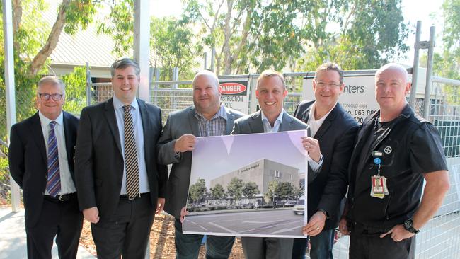 Looking over plans for the Caboolture Hospital redevelopment are Dr Lance Le Ray, State Labor MP for Morayfield Mark Ryan, State Labor MP for Kurwongbah Shane King, Health Minister Steven Miles, State Labor MP for Bancroft Chris Whiting and hospital emergency department director Dr Sean Keogh.