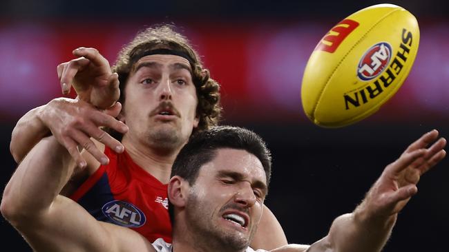 MELBOURNE, AUSTRALIA - AUGUST 13: Marc Pittonet of the Blue competes with Luke Jackson of the Demons during the round 22 AFL match between the Melbourne Demons and the Carlton Blues at Melbourne Cricket Ground on August 13, 2022 in Melbourne, Australia. (Photo by Darrian Traynor/Getty Images)