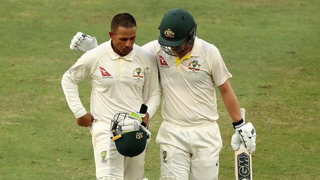 Usman Khawaja (left) and Travis Head leave the field yesterday. Photo: Getty Images