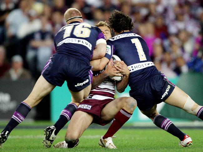 Michael Crocker and Billy Slater knock Brett Stewart out of the 2007 NRL grand final.