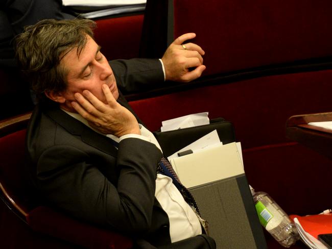 Tim Quilty rests his eyes during the marathon debate. Picture: Andrew Henshaw