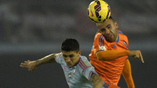 Nicolas Otamendi (R) has impressed during his time with Valencia.