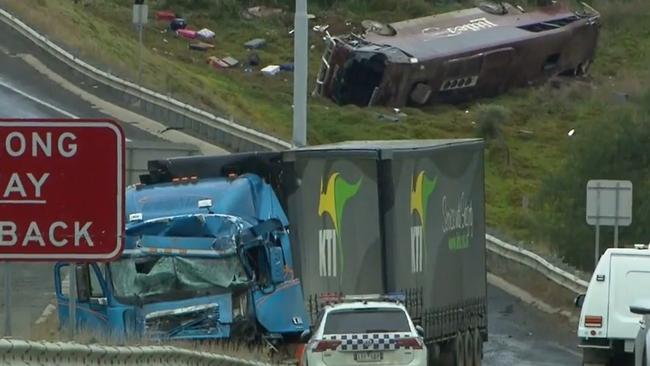 A school bus carrying 32 people has flipped on the Western Highway in Bacchus Marsh on November 21, 2022., Police are investigating the crash between a school bus and a truck that occured at around 3.15am. Picture: Nine News