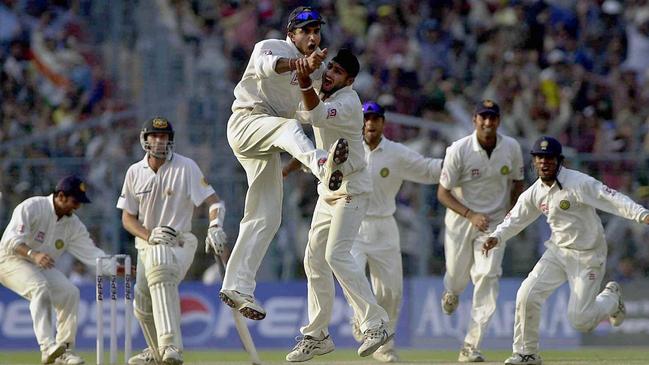 India captain Sourav Ganguly and wicket taker Harbhajan Singh celebrate as Glenn McGrath looks on as India win the second Test at Eden Gardens in 2001. Picture: AFP