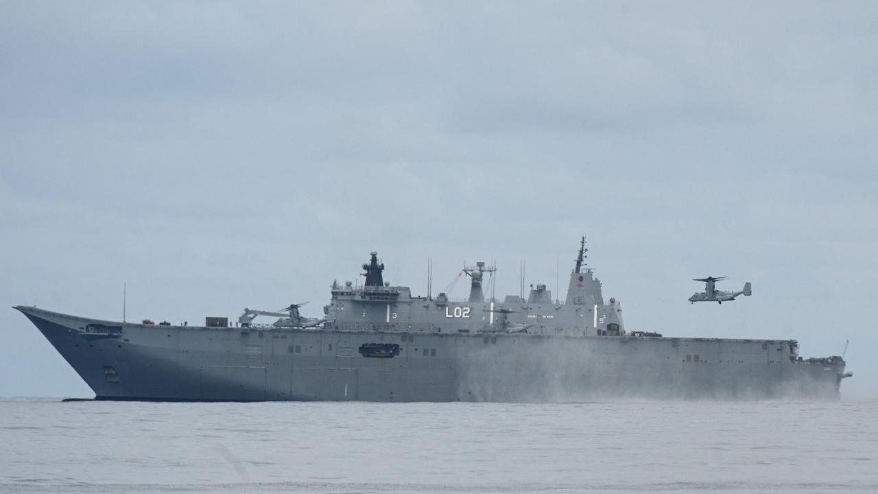 A US Marines V-22 Osprey aircraft lands on Australian landing helicopter dock ship HMAS Canberra during a joint exercise between Australian and Philippine troops on the South China Sea on August 25, 2023. Picture: AFP