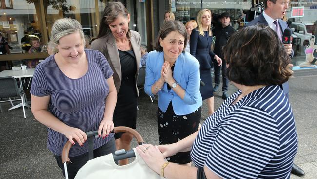 Premier Gladys Berejiklian and Wendy Lindsay speak to mums during a walk through Revesby. Picture: Richard Dobson