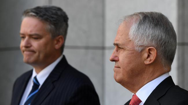 Mathias Cormann and Malcolm Turnbull are open to the idea of allowing the banking royal commission more time. Pic: AAP