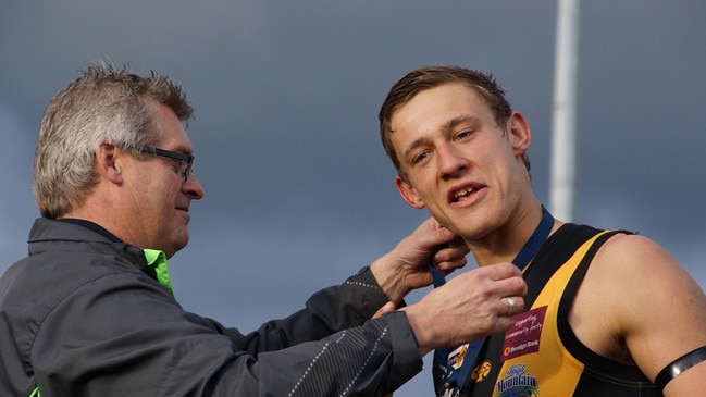 Woori Yallock’s Ben Monkhorst is presented with a premiership medallion. Picture: Robyn Kuys