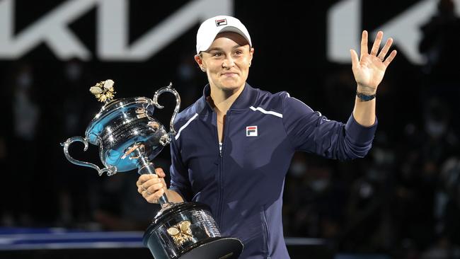 Ash Barty holds the Australian Open trophy after winning the women’s final on Saturday night. Picture: David Caird