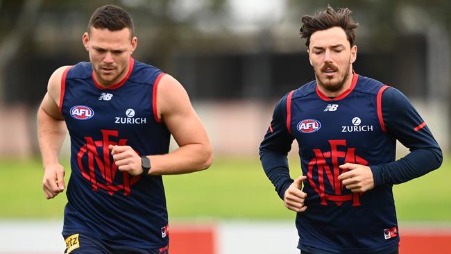 Steven May and Demons teammate Michael Hibberd.