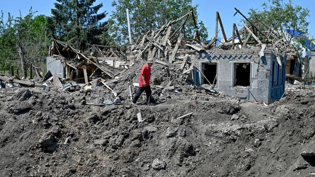 A man walks past debris of a house destroyed by an earlier Russian missile attack, in the town of Kramatorsk, Donetsk Region, on June 19, 2023, amid the Russian invasion of Ukraine. Picture: Genya Savilov / AFP