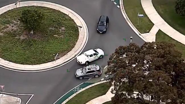 The white Hilux was allegedly driven through the roundabout the wrong way. Photo: Queensland Police