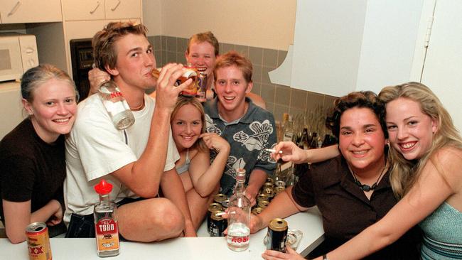 November 20, 1997 (Lto R) Melitte Hoskins, 'Spud' Andrew Kinsella (second from left), Amy Baines, Radel Armstrong , 'Meggsie' James O'Donnell (third from right), and Sarah Bartholomeusz celebrate Schoolies on the Gold Coast. Picture: Mick Toal.