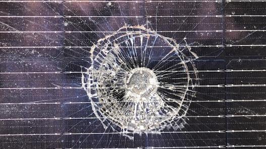 Mrs Schou's smashed solar panels from an alleged wayward golf ball. Pic: Supplied.