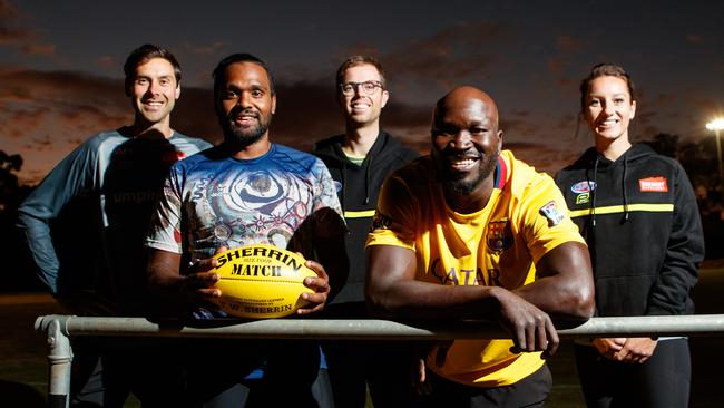 Adelaide Footy League umpires Zibeon Fielding and Emmanuel Irra with AFL Umpires Craig Fleer, Leigh Haussen and Eleni Glouftis. The two iconic South Australians are one step closer to achieving their AFL umpiring dream. Picture: Matt Turner