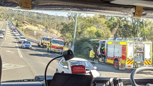 Rural Fire Service and NSW Fire and Rescue brigades were called to deal with sheets of building material that had blown on to Mona Vale Rd at Ingleside during Friday's morning peak. There were initial concerns the sheeting may have been made of asbestos. Picture: RFS (Ingleside)