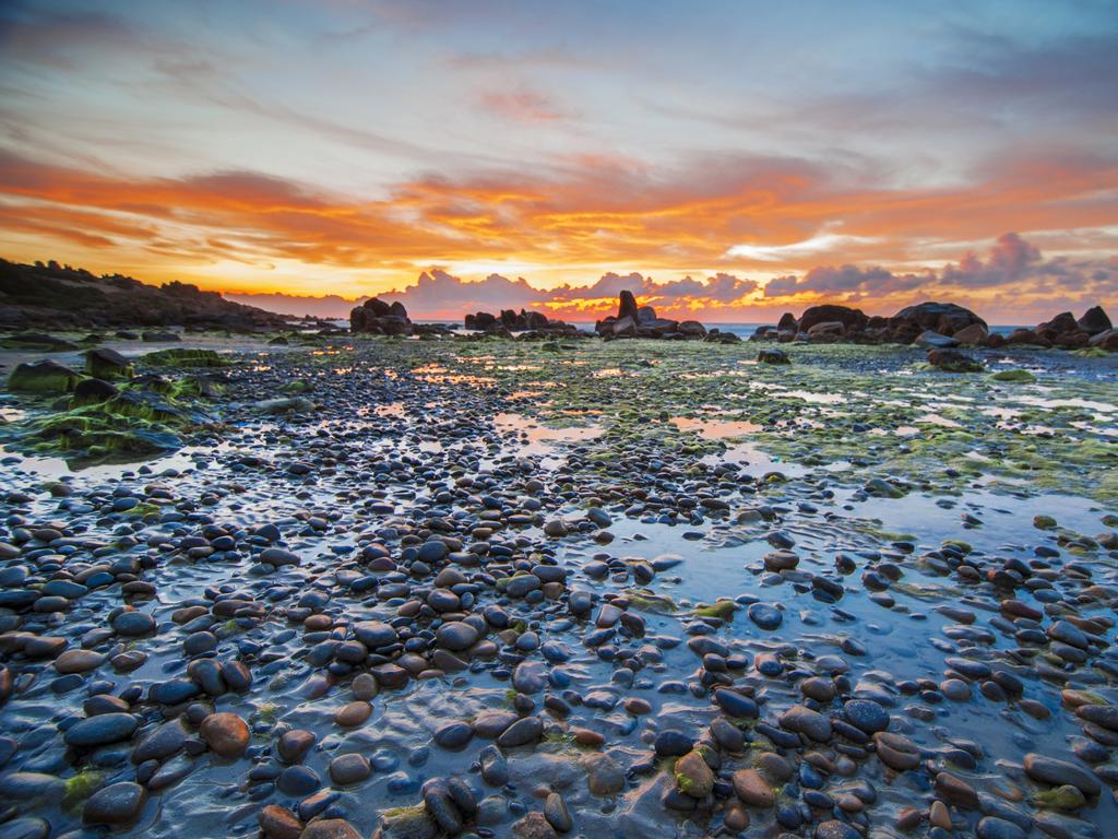 <p><b>CO THACH BEACH: </b>The otherworldly scenery of Co Thach is enough to entice eager photographers out of bed by 3am to capture it at its most magnificent. The rocky beach near Tuy Phong, about an hour from the tourist town of Mui Ne, is known for its stones of seven colours, with striking emerald moss-covered rocks jutting out at low tide.</p>