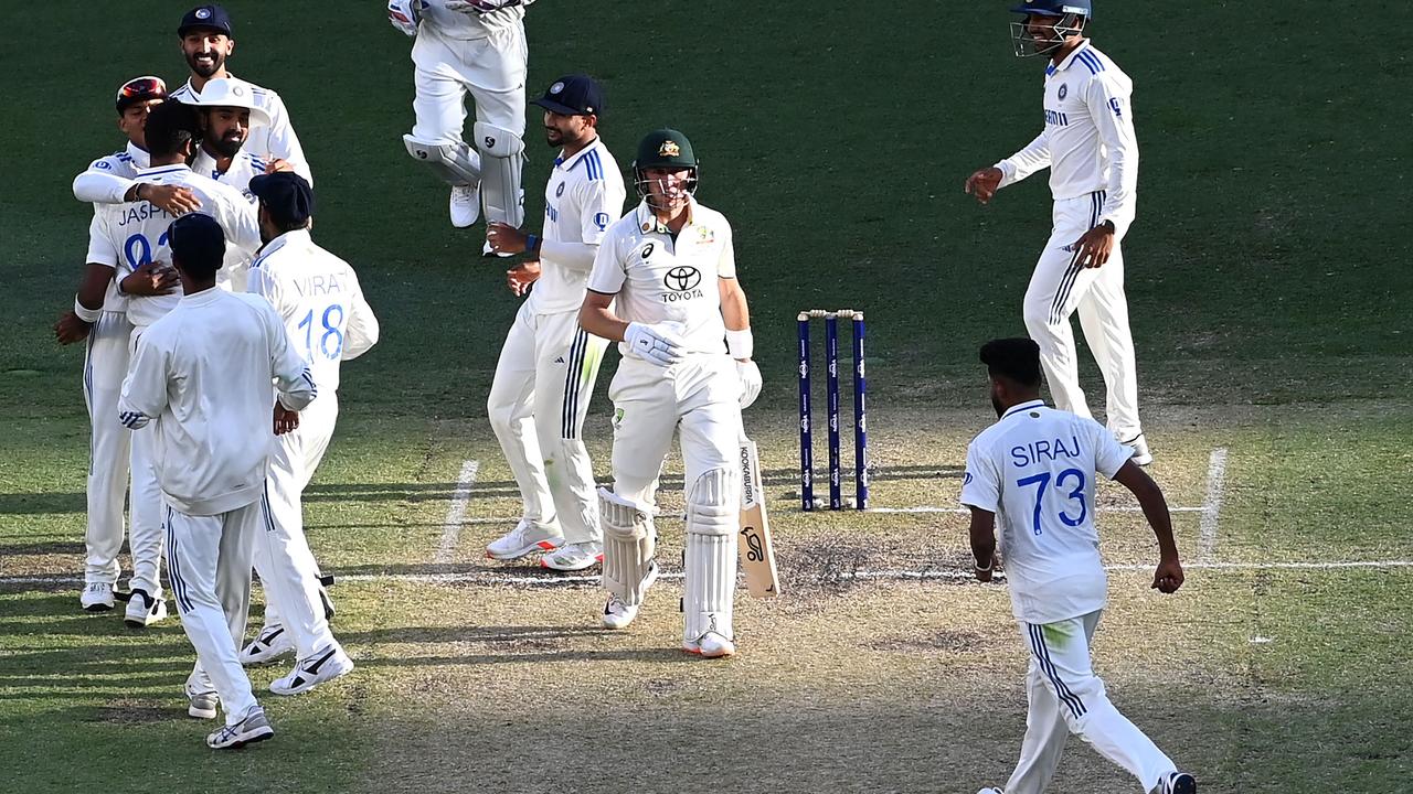 India’s players celebrate the wicket of Marnus Labuschagne in Perth. (Photo by SAEED KHAN / AFP) /