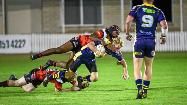 NO CHANCE TO SHINE: The Waves' Chad King gets tackled by Wests Robert Telfer in A-grade earlier this season. He could have been one of the players picked to play if Bundaberg fielded an under-18 side. Picture: Brian Cassidy