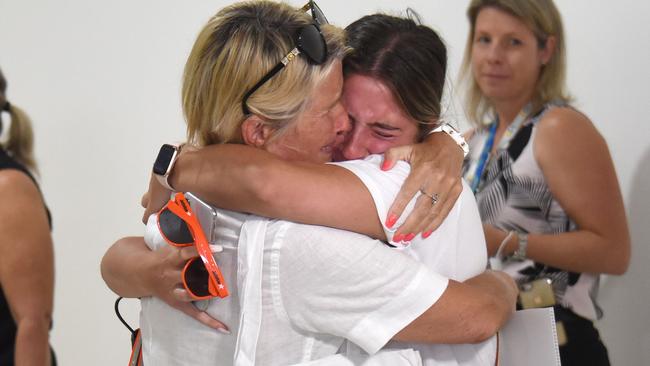 Maree Dinger and Lucy Mangion embrace after the first flight from Melbourne landed at Gold Coast Airport in Coolangatta. Picture: NCA NewsWire / Steve Holland