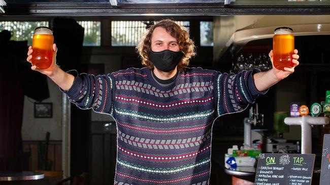 The Union Hotel in Brunswick is still serving up locals, including with jars of craft beers. Matthew Cuthbertson serves up some jars of ale. Picture: Mark Stewart