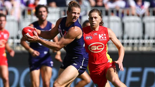 Nat Fyfe of the Dockers looks to handball.